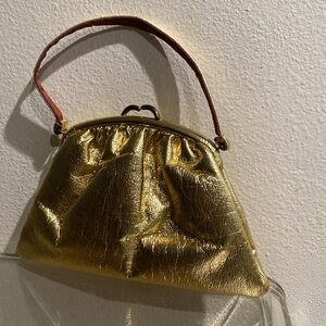 I am selling a very fashionable clutch purse in a beautiful gold color!